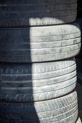 New and Used Car Tires on the Store Rack. Automotive Service.