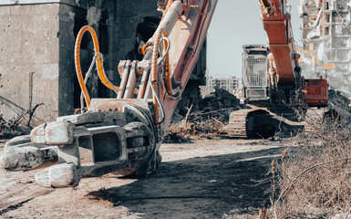 construction equipment destroys houses damaged during the war in Ukraine