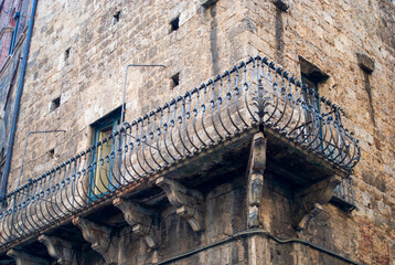 Naklejka premium an ancient terrace in a historic building in the center of little Siena in Italy
