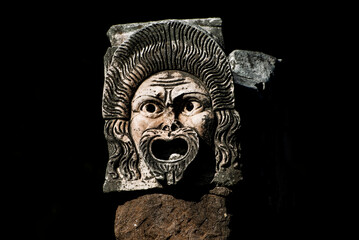 Stone Masks in the Roman Amphitheater Ostia Antica, Rome, Italy - obrazy, fototapety, plakaty