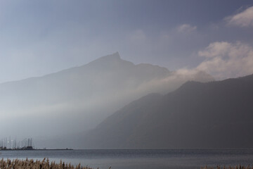 Fototapeta na wymiar fog on the lake du Bourget with mont Dent du chat