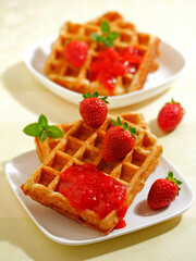 Waffles with strawberry jam.