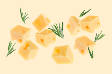 Cheese and rosemary flying on beige background