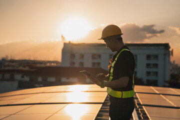 Portrait of Service engineer checking solar cell on the roof for maintenance if there is a damaged...
