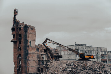 construction equipment destroys affected houses war in Ukraine