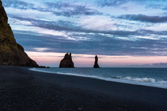 Gorgeous landscape with basalt rock formations Troll Toes on Black beach Reynisfjara near the village of Vik. Location: Reynisfjara Beach, Vik Village, Iceland (Sudurland), Europe