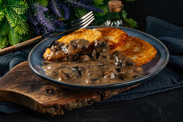 Crispy potato pancakes with mushroom sauce