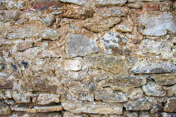 stone wall of abandoned house,background