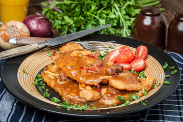 Potato pancakes with meat, vegetable, tomato and parsley.