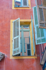 Nice, France, 02/13/2024: The architecture of the old town in Nice boasts a blend of Italian style with French motifs, characterized by colorful houses and narrow streets.