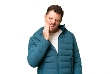 Brazilian man over isolated chroma key background with toothache