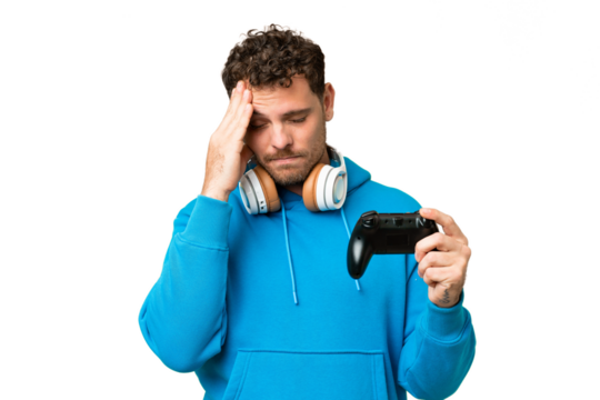 Brazilian man playing with a video game controller over isolated chroma key background with headache