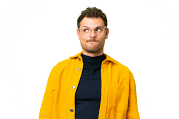 Brazilian man over isolated chroma key background having doubts while looking up