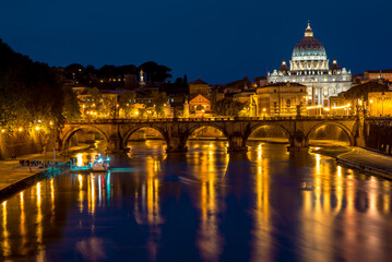 Fototapeta na wymiar Rome, Italy. Papal Basilica Of St. Peter In The Vatican And Aelian Bridge In Evening Night Illuminations. Day To NIght Time Lapse. Sunset Time.