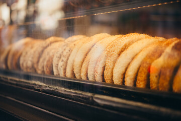 Freshly baked traditional turkish simit bagel on sale in a local bakery in Istanbul, Turkey.