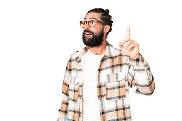 Naklejka premium Young man with beard over isolated chroma key background intending to realizes the solution while lifting a finger up