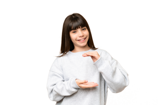 Little girl over isolated green chroma key background holding copyspace imaginary on the palm to insert an ad