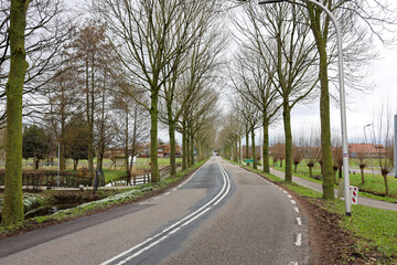 Fototapeta premium Bicycle path and road at Middelweg in Moordrecht