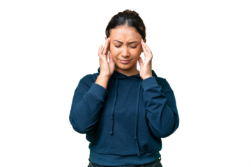 Young Uruguayan woman over isolated chroma key background with headache