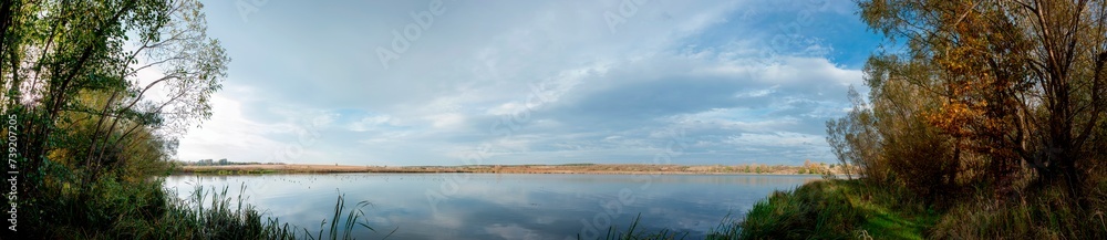 Wall mural Panorama lake view in sunrise time .Sunrise at the lake