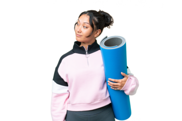 Young sport woman going to yoga classes while holding a mat over isolated chroma key background looking to the side