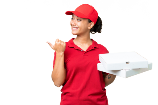 pizza delivery woman with work uniform picking up pizza boxes over isolated chroma key background pointing to the side to present a product