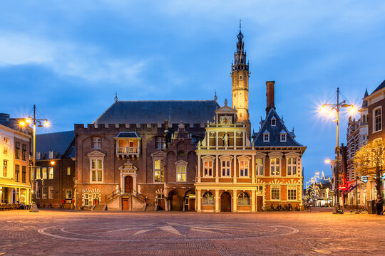 Square and town hall at the Grote Markt at night with monumental houses in Haarlem.
