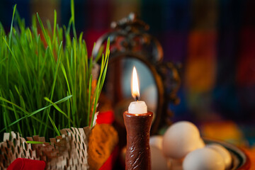 Burning candle on the festive table Nevruz