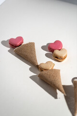A group of heart-shaped French macaron cookies,Sweet macaroons macarons in heart shapes,background...