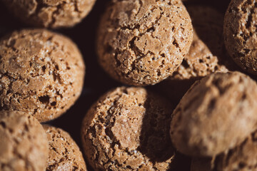 Fototapeta premium sweet almond cookies biscuits (amaretti),Delicious portrait of a pile of tasty traditional Dutch snacks called pepernoten or peper nuts.