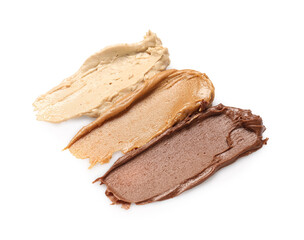 Smears of tasty nut butter isolated on white