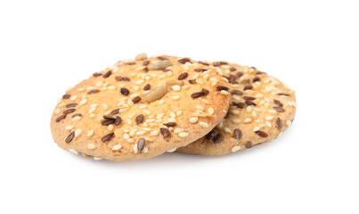 Round cereal crackers with flax, sunflower and sesame seeds isolated on white