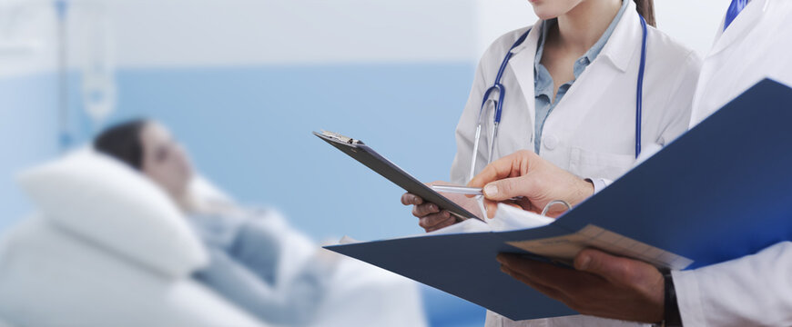 Doctors checking patient's medical records