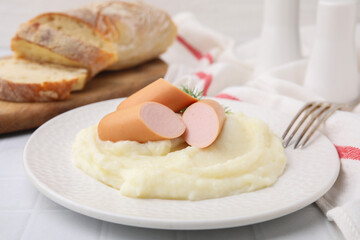 Delicious boiled sausages and mashed potato on white table, closeup