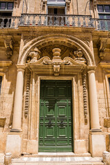 Door and balconies with worked structure in the center of Mdina (Malta) - 739219485