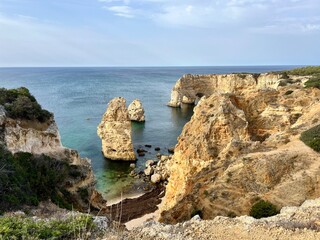 Rocky ocean coast, cliff, azure ocean surface, formation