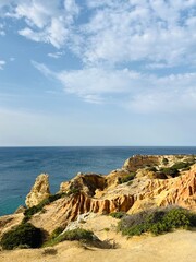 Fototapeta na wymiar Rocky ocean coast, cliff, azure ocean surface, formation