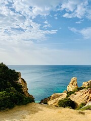 Rocky ocean coast, cliff, azure ocean surface, formation