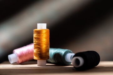Several spools of thread. Multi-colored spools of thread. Thread for seamstresses.