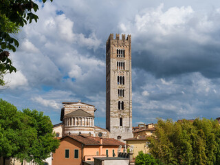 San Frediano (St Fredianus) romanesque church apse with medieval bell tower in Lucca historical center - 739224635