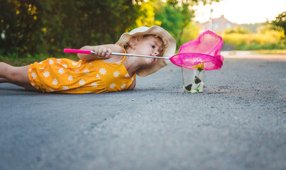 A child catches a butterfly in nature. selective focus.