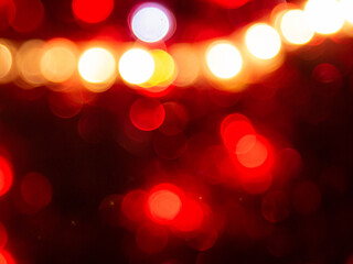 abstract background with bokeh defocused lights on red background