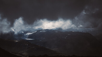 Dark mountain views in Norway during a storm.