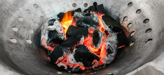 Hot coals in an iron pan, charcoal for cooking BBQ, flames fire graphic resource object retouch...