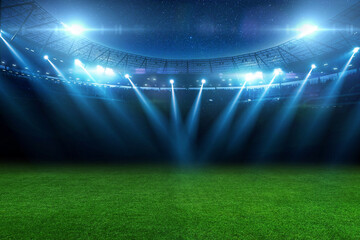 beautiful sports stadium with a green grass field shines with blue spotlights at night with stars....