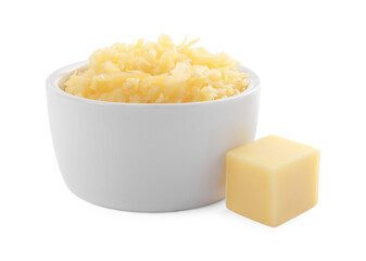 Grated cheese in bowl and piece of one isolated on white