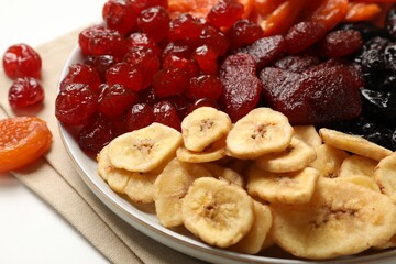 Delicious dried fruits on white table, closeup