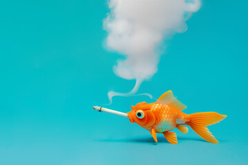 Yellow goldfish smoking a cigarette on isolated pastel blue background with copy space. The concept of smoking is addiction harmful to health. Unhealthy, toxic, dangerous habits.