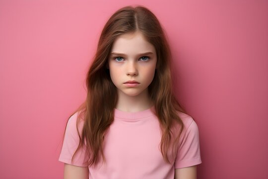 Portrait of a sad young girl against a simple pink backdrop. Concept Portrait Photography, Sad Emotions, Young Girl, Pink Backdrop, Simple Setup