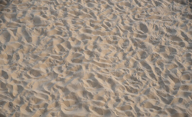 Fototapeta na wymiar Sand on beach. Top view background